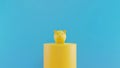 Yellow Piggy Bank on a podium with blue background. 3D rendering. savings money concept. Yellow Piggy Bank and saving idea. Blue