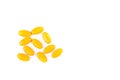 Yellow pill on white background