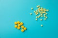 Yellow pills . Blue background with copy space for text Royalty Free Stock Photo