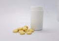 Yellow pills isolated over white Royalty Free Stock Photo