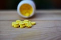 Yellow pills placed on the table