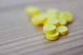 Yellow pills placed on the table