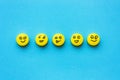Yellow pills with smiles on a blue background. The concept of tr Royalty Free Stock Photo