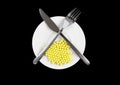 Yellow pills-vitamins ,with fork and spoon Royalty Free Stock Photo