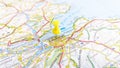 A yellow pin stuck in Edinburgh on a map of Scotland