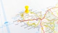 A yellow pin stuck in the island of Anglesey on a map Royalty Free Stock Photo