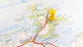 A yellow pin stuck in the island of RÃ¼gen on a map of Germany