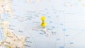 A yellow pin stuck in the island of skyros skiros on a map of Greece Royalty Free Stock Photo