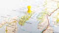 A yellow pin stuck in a map of the island of Jura Scotland Royalty Free Stock Photo
