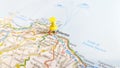 A yellow pin stuck in Palermo Sicily on a map of Italy Royalty Free Stock Photo