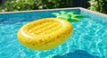 Yellow Pineapple Inflatable Pool Float in a Blue Pool Royalty Free Stock Photo