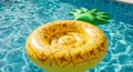 Yellow Pineapple Inflatable Pool Float in Blue Water Royalty Free Stock Photo