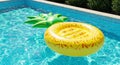Yellow Pineapple Pool Float in a Blue Pool Royalty Free Stock Photo