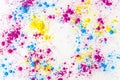 yellow pink blue holi color powder splatter white background. High quality photo Royalty Free Stock Photo