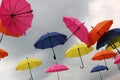 Yellow, Pink, Blue And Red  Color Umbrellas On Sky Background
