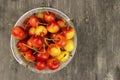 Yellow and pink cherries in a plastic container