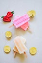 yellow and pink colorful fruity with lemon, strawberry  sliced  ice cream stick on white marble background Royalty Free Stock Photo