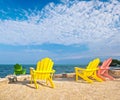 Yellow and pink colorful lounge chairs on a beach in Florida Royalty Free Stock Photo