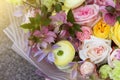 Yellow pink wedding bouquet of florist with roses and different flowers close up, macro. Floral background Royalty Free Stock Photo