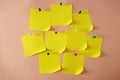 Yellow pinned sticky notes with curled corner on pink background, copy space for design Royalty Free Stock Photo