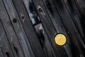 A yellow pipe cap on the wooden deck of a battleship.