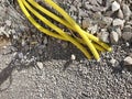 Yellow pipes for electric cables or water sticking from the ground at construction site Royalty Free Stock Photo