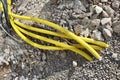 Yellow pipes for electric cables or water sticking from the ground at construction site Royalty Free Stock Photo