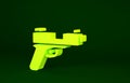 Yellow Pistol or gun icon isolated on green background. Police or military handgun. Small firearm. Minimalism concept Royalty Free Stock Photo