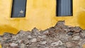 Yellow plaster and rubble rock wall, Mexico