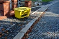 the yellow plastic box is a gravel deposit in the hill on Royalty Free Stock Photo
