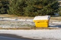 Yellow plastic box with salt or sand on the street Royalty Free Stock Photo