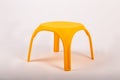 Yellow plastic childrens table on white background