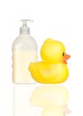 Yellow plastic duck and boat bath dispenser isolat Royalty Free Stock Photo