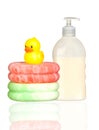 Yellow plastic duck over sponges and boat bath dis Royalty Free Stock Photo