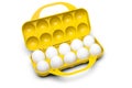 Yellow plastic egg box with ten white eggs isolated with clipping path Royalty Free Stock Photo