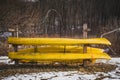 Yellow Kayaks in Storage Outside, Winter