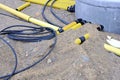 Yellow plastic pipes and electric cables Royalty Free Stock Photo