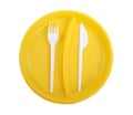 Yellow plastic plate, fork and knife