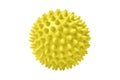 Yellow plastic spiny massage ball isolated on white. Concept of physiotherapy or fitness. Closeup of a colorful rubber