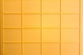 yellow plastic tile background, closeup of photo, elevated top view Royalty Free Stock Photo