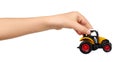 Yellow plastic traktor toy. Farming vehicle, harvest equipment