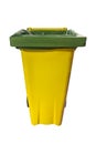 yellow plastic trash container with wheels isolated on white background Royalty Free Stock Photo
