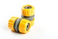 Yellow plastic water hose connectors isolated over white background Royalty Free Stock Photo