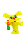 Yellow plasticine rabbit with carrot