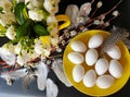 Eggs With Willow tree and  White Spring flower bouquet  still life green yellow red feathers down decoration easter yellow cu Royalty Free Stock Photo