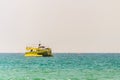 Yellow pleasure boat at sea water