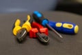 Yellow pliers tool set red nippers and two blue screwdrivers Royalty Free Stock Photo