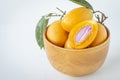 marian plum cut in half yellow flesh in a bowl Royalty Free Stock Photo