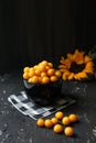 Yellow plums on the black background. Ingredients for a jam. Food photography. Vertical image. Yellow sunflower, Autumn Royalty Free Stock Photo