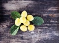 Yellow plums. Fresh sweet fruits on old wooden boards rough background Royalty Free Stock Photo